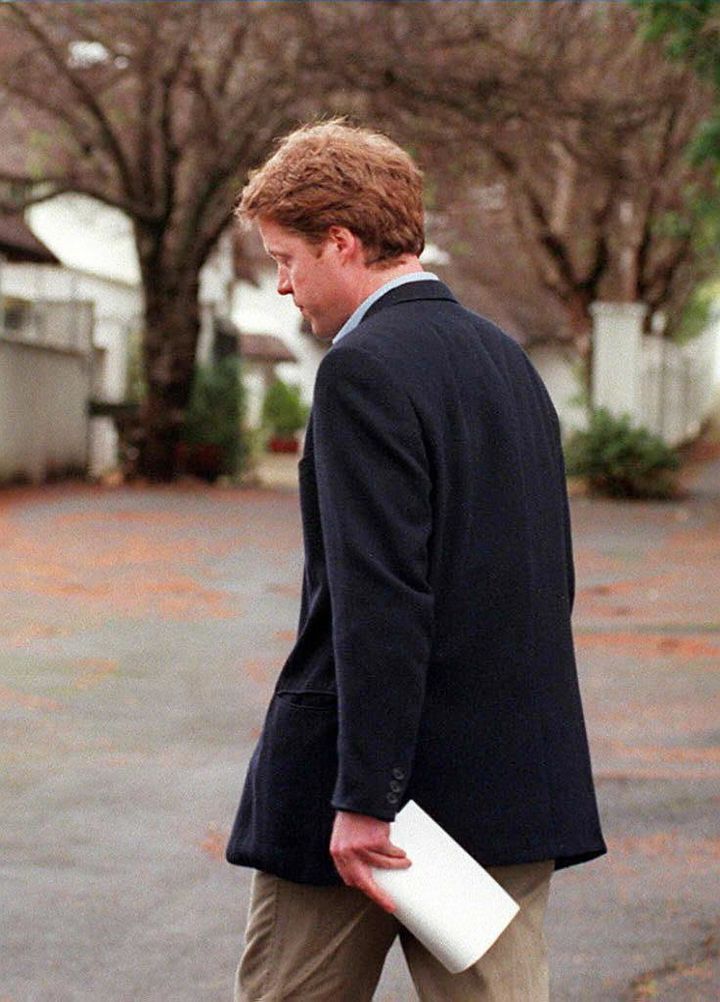 Princess Dianas brother Earl Spencer turns away from the press after reading a brief statement about his sisters death at the entrance to his home in Cape Town in 1997.