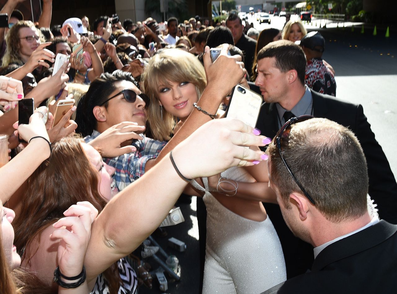 Taylor Swift takes selfies with fans during the 2015 Billboard Music Awards at MGM Grand Garden Arena on May 17, 2015, in Las Vegas.