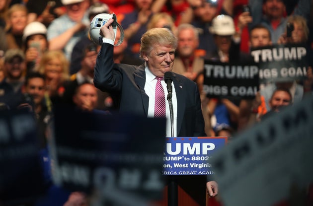 Then-candidate Donald Trump signals support for&nbsp;coal miners during a May 2016 rally in West Virginia....