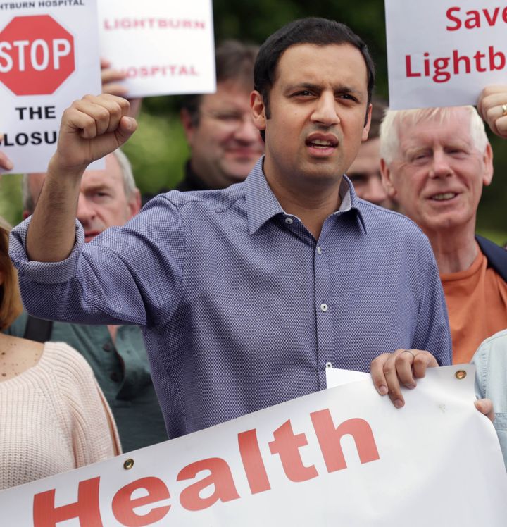 Labour health spokesman Anas Sarwar (left) joins with demonstrators as they protest against closure of Lightburn Hospital