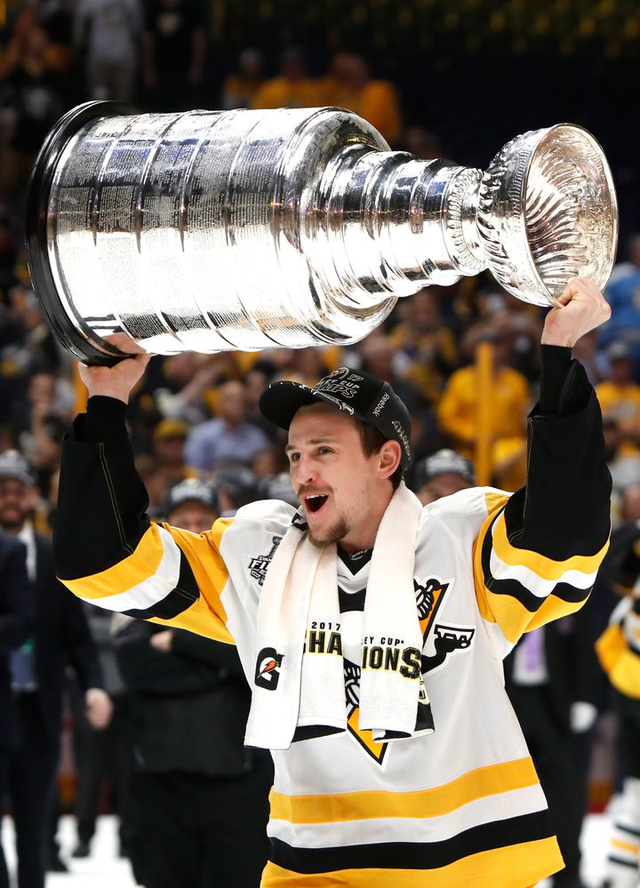 Dad-to-be Josh Archibald hoisted the Stanley Cup after the Penguins won their second straight title in June.