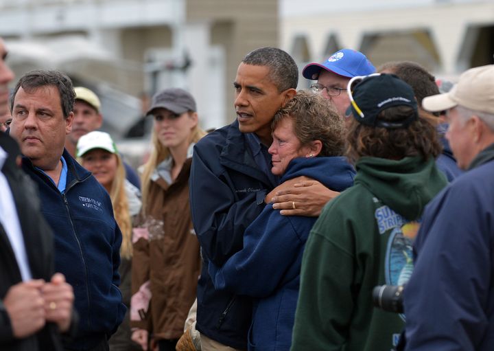 US President Barack Obama comforts Hurricane Sandy survivor in Brigantine, New Jersey, on October 31, 2012.