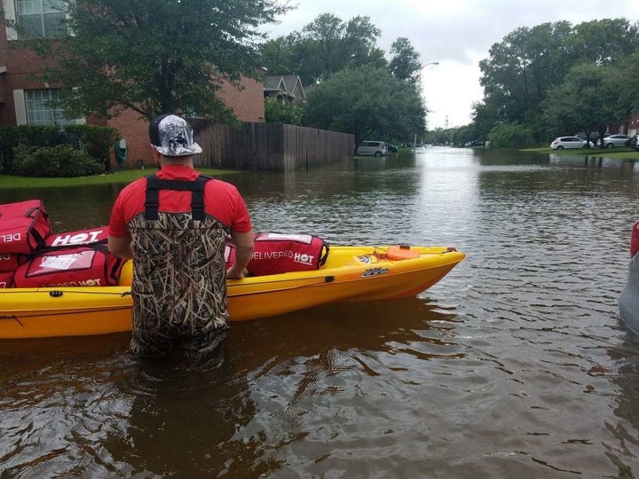 The pizzas were described as "still steaming" when they were brought to homes where people had taken shelter from the storm.