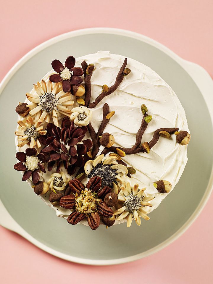 A top view of Gardner's veggie cake, decorated with nuts.