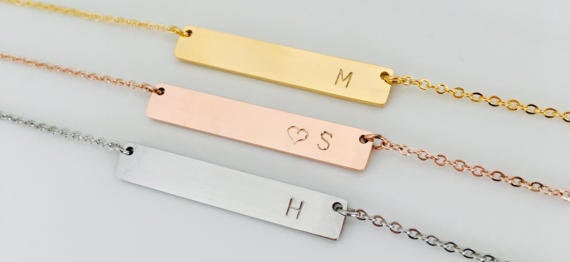 These initial necklaces, perfect for birthdays, holidays, or bridesmaids gifts, are one of hundreds of items on sale at Etsy this Labor Day. <a href="https://www.etsy.com/listing/294056891/bridesmaids-rose-gold-bar-gold-bar?ref=deals_center" target="_blank">Shop them here</a>. 