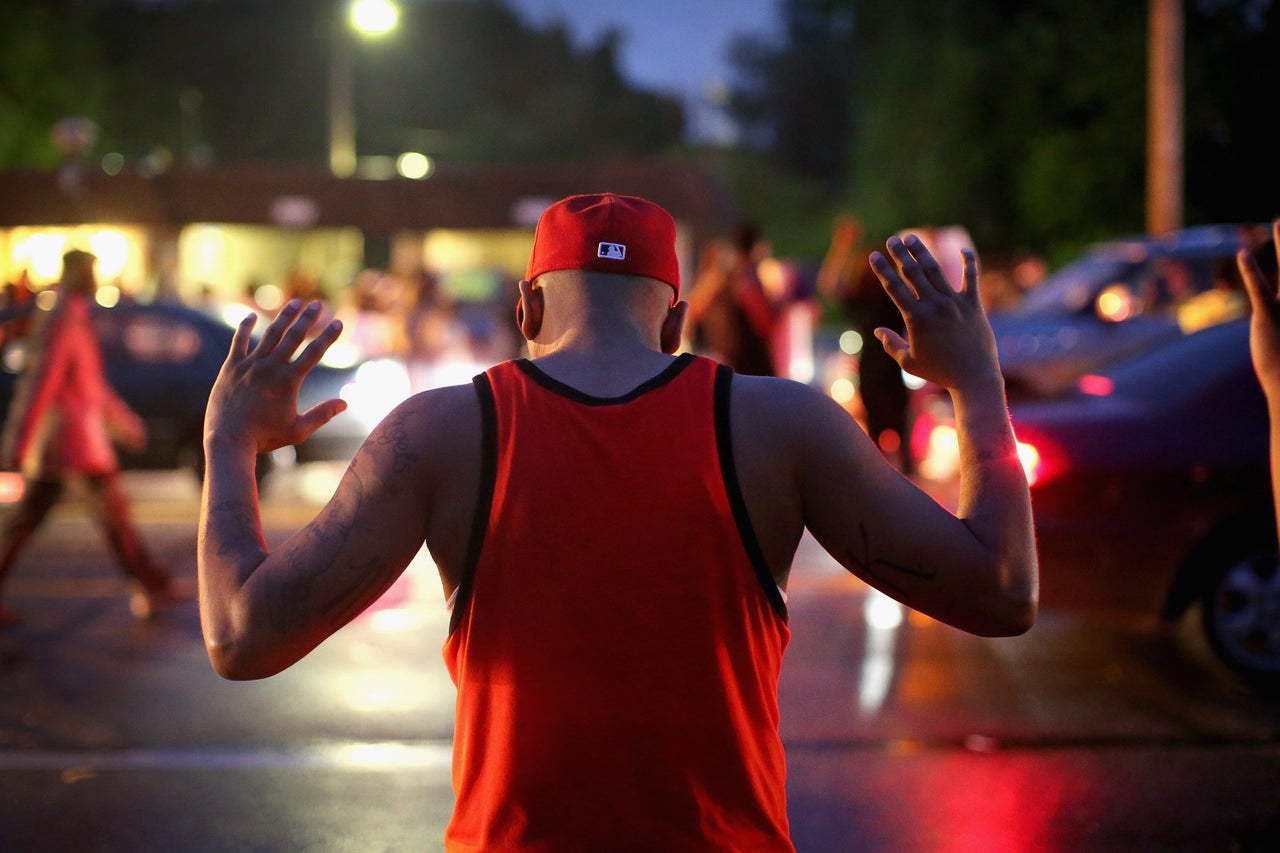 Demonstrators gather along West Florissant Avenue in Ferguson on Aug. 15, 2014.