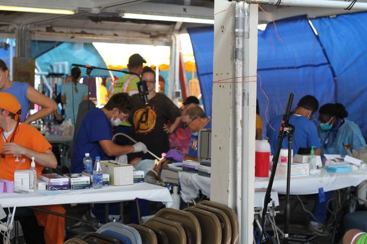<p>Volunteer dentists near the end of their second day treating patients at a clinic hosted by Remote Area Medical in Wise County, Virginia. </p>