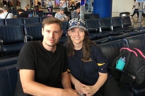 Robert Heise, 28, and Zana Shaw, 21, wait at Newark Liberty International Airport Thursday for their flight to Hous