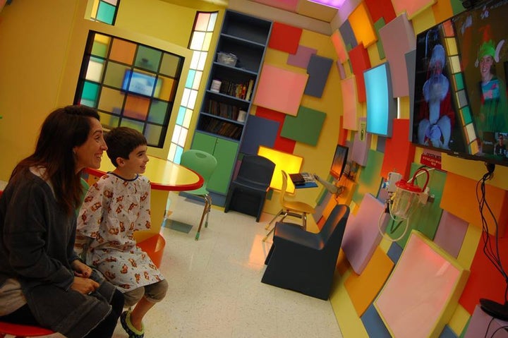 <p>Young patient enjoys a video chat in one of the game rooms provided by the Companions In Courage Foundation</p>