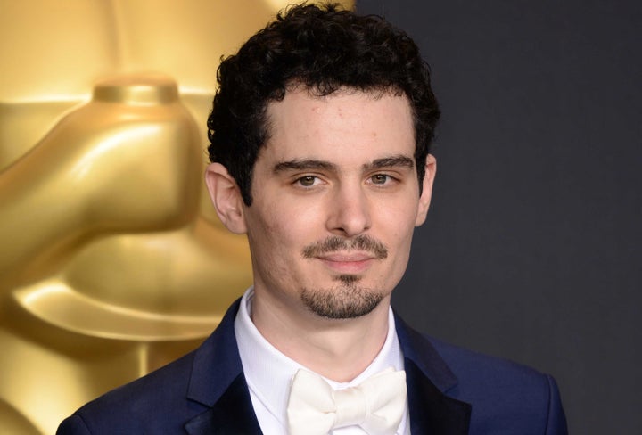 Damien Chazelle poses with the award for Directing for La La Land 89th Academy Awards.