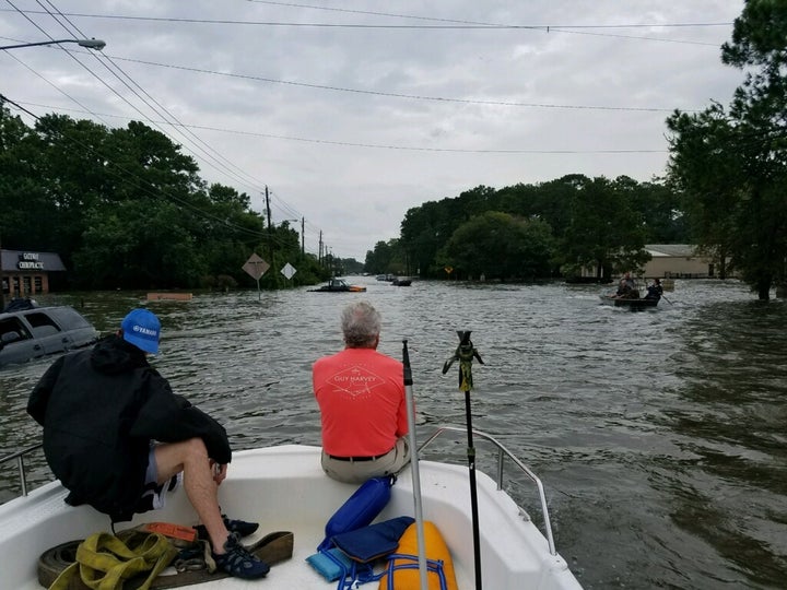 Kenneth Yates and Robert Young on Yates’ Bay Stealth boat in Dickinson, Texas, on Aug. 27 as they set out to rescue people.