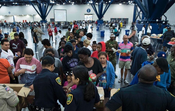 <p>Hurricane Harvey flood victims gather at a shelter. (Source: Brendan Smialowski/AFP/Getty Images)</p>