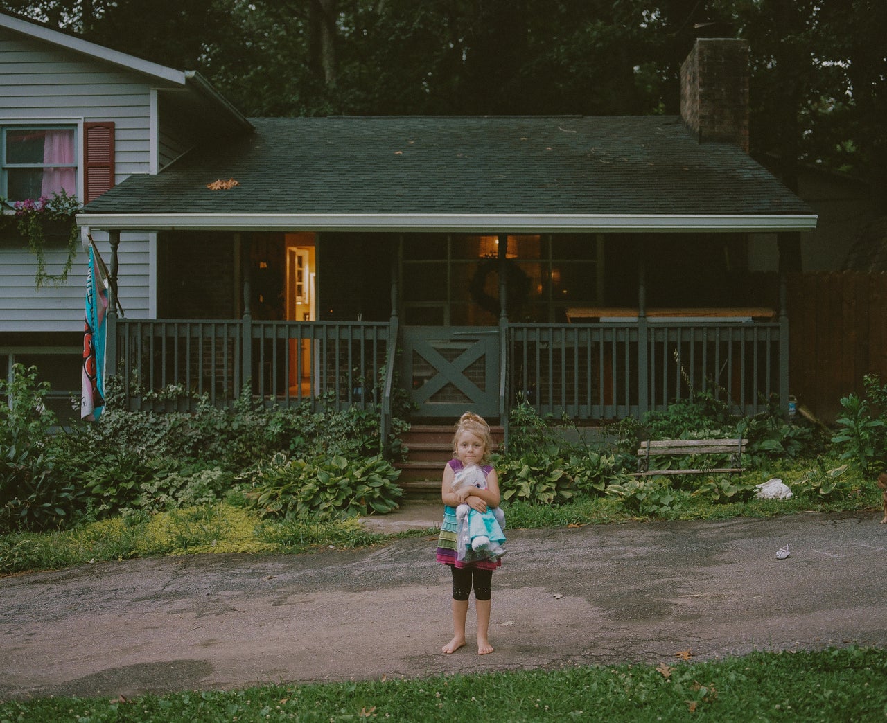 Emma in front of her home.