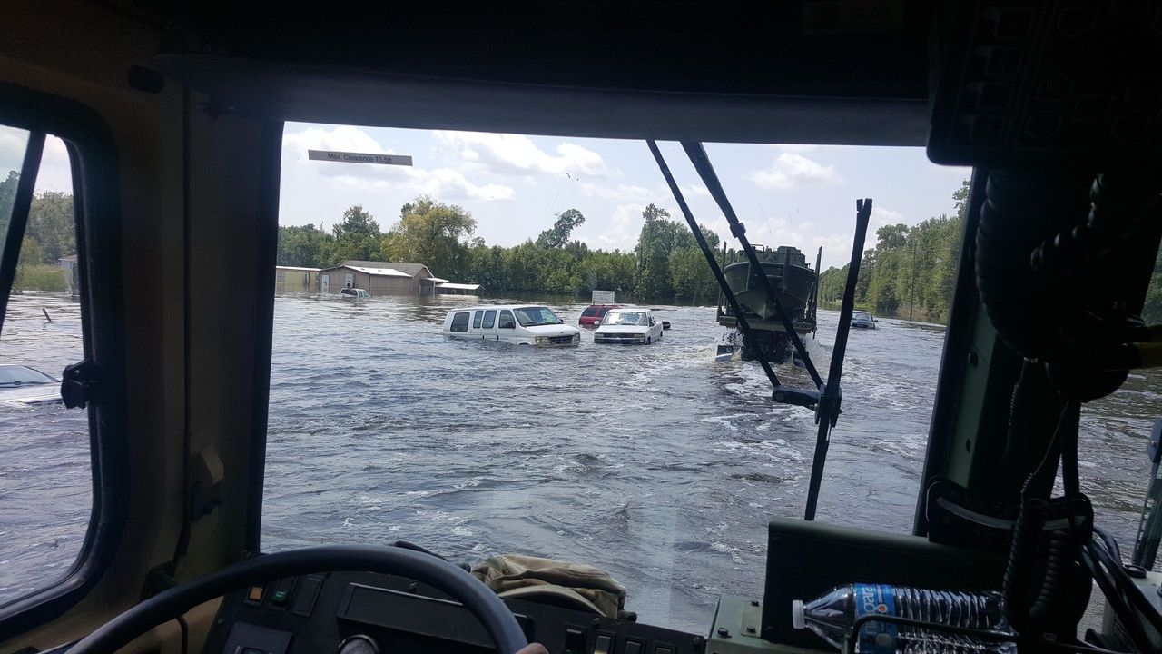 Floodwaters overtake vehicles in southeast Texas.
