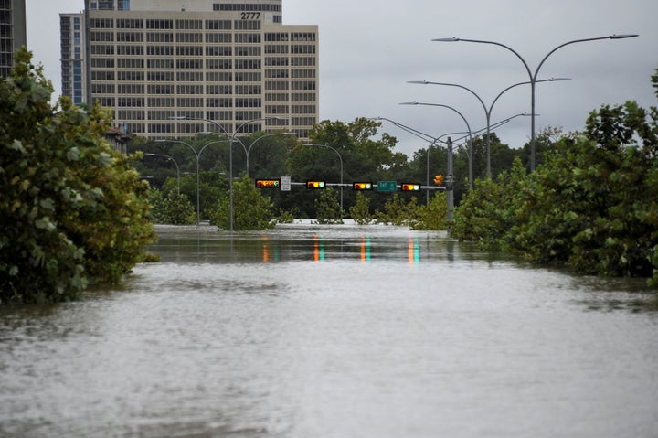 A downtown street is submerged in water in Houston, Texas during Hurricane Harvey.