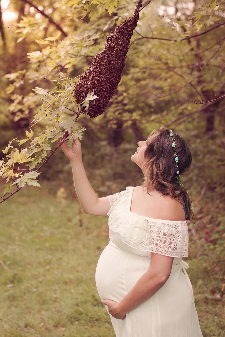 Maternity shoot with bees 'Bee' Belly: Woman poses with honeybees