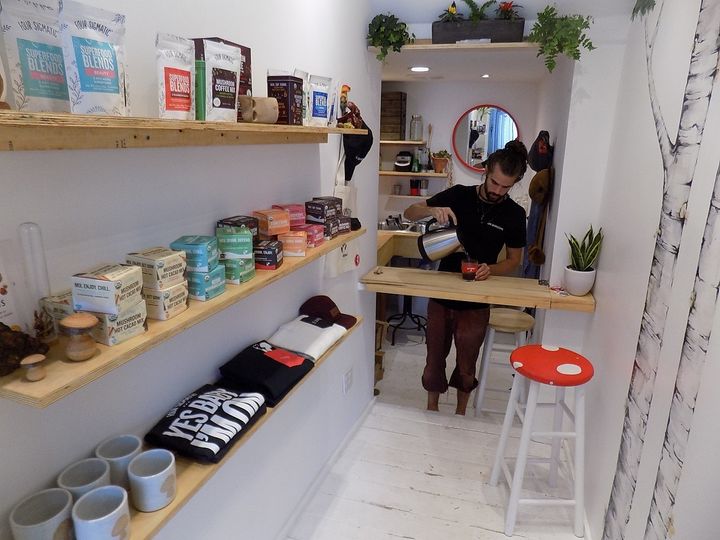 <p>Bryce pours mushroom coffee, one of the Shroom Room’s many healthy products being sampled.</p>
