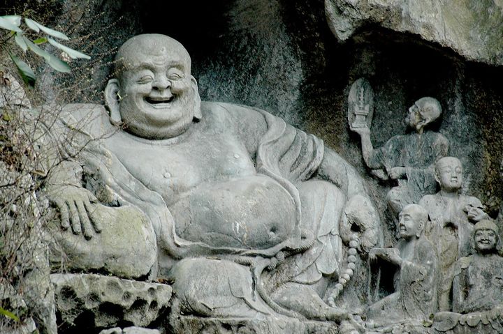 <p> <em>The Laughing Budda, one of 340 statues in the limestone on Feilai Peak – the Peak Flying From Afar – at Lingyin Temple</em></p>