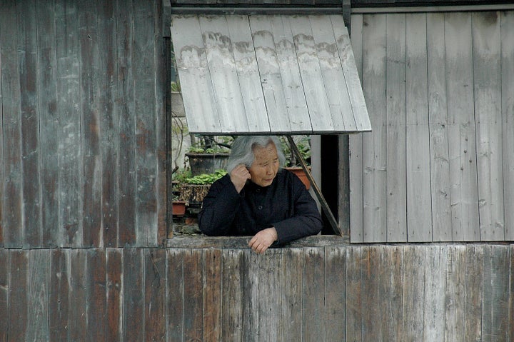  A resident of Wuzhen, one of the ancient river towns, has been preserved in Zhejiang Province as a living history museum 