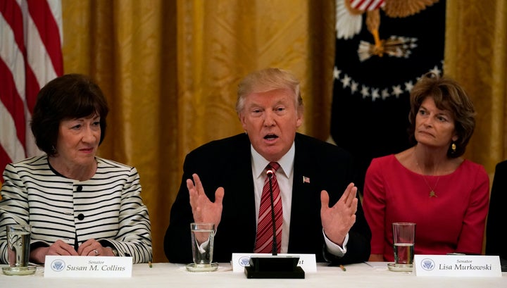 Murkowski, along with Sen. Susan Collins of Maine, sitting next to President Donald Trump in a June White House meeting where he's pressuring Republicans to repeal Obamacare. The two women didn't budge in opposing the effort.