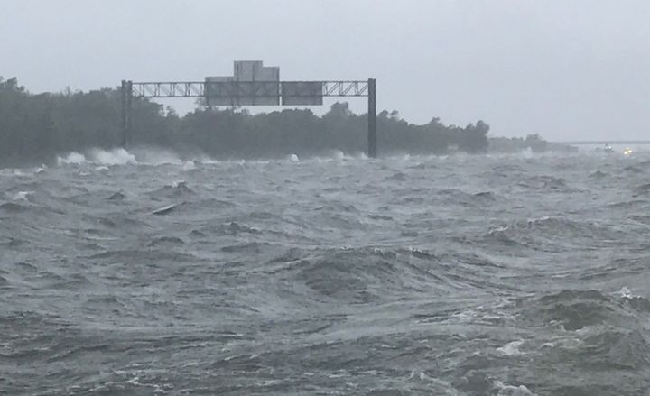 Strong winds turned a flooded Interstate 10 into rough waters just outside of Houston.