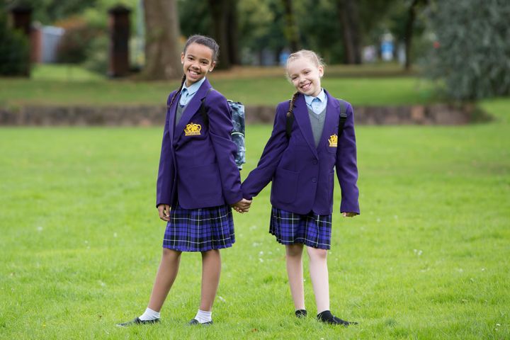 Millie (left) and Marcia Biggs, 11, heading to secondary school.