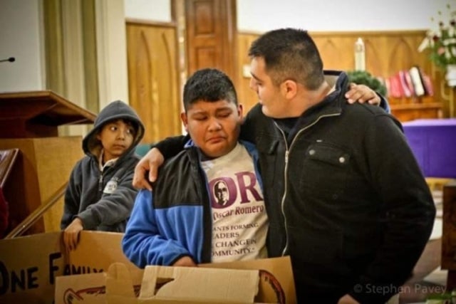 Tellez with his younger brother and a cousin in the background