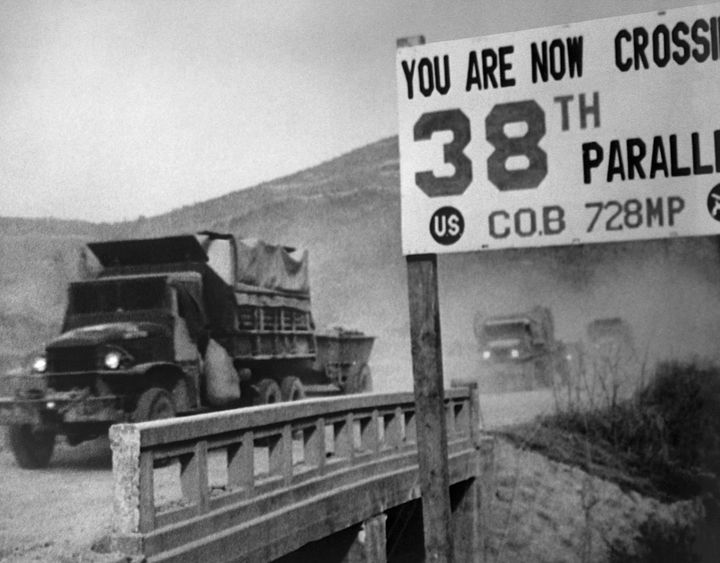 United Nations forces cross the 38th parallel while withdrawing from Pyongyang, the North Korean capital, 1950.