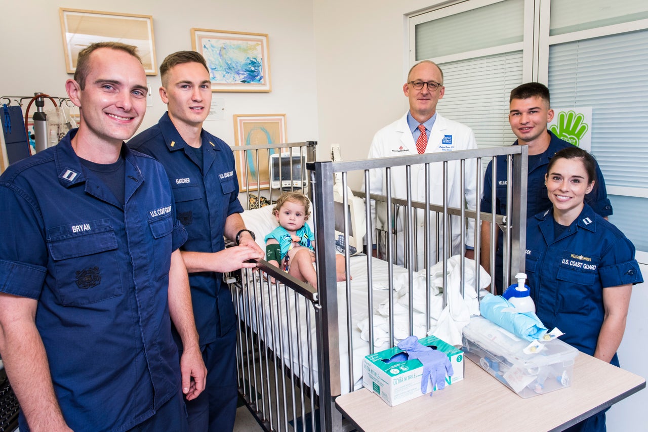 From left to right: Bryan, Gardner, dialysis patient Brannon Morgan, Dr. Michael Braun, Coast Guard Ensign Gregory Velliky and Lt. Lindsay Cook.