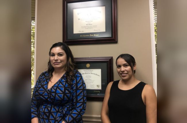 Legal assistant Karla Martinez (R) is pictured with boss Georgina Lepe at Lepe’s law office in Rancho Cucamonga, California. U.S. in this September 1, 2017 handout photo. Karla Martinez/Handout via REUTERS