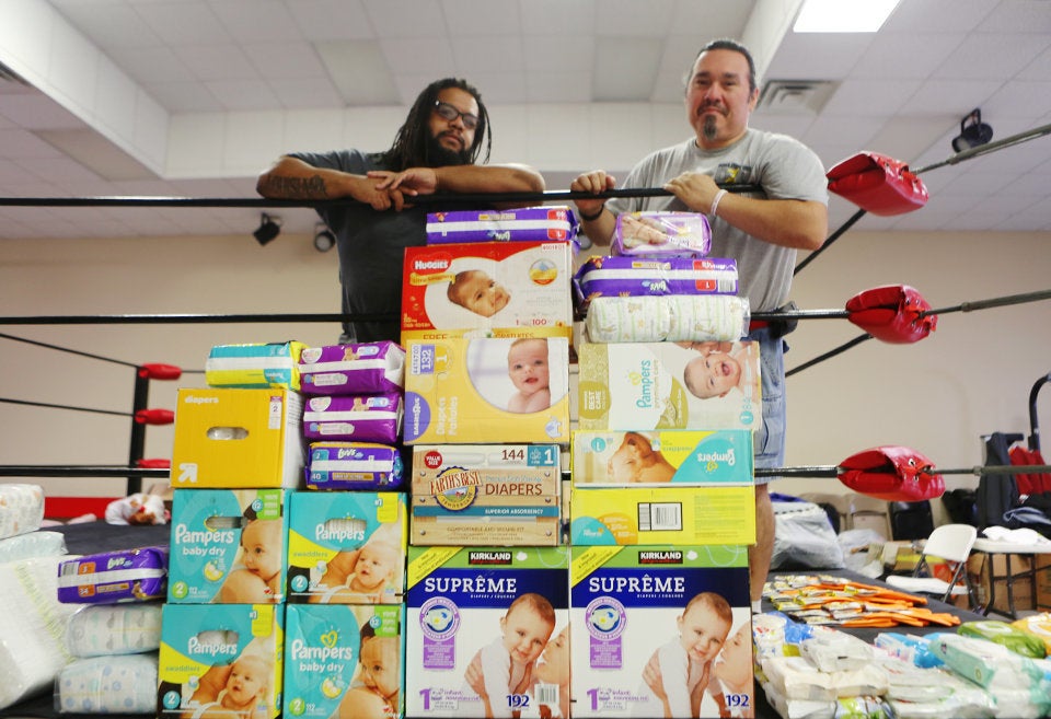 Colony Soto, right, set up his training center as an impromptu supply shelter, and helped get food and supplies to a domestic