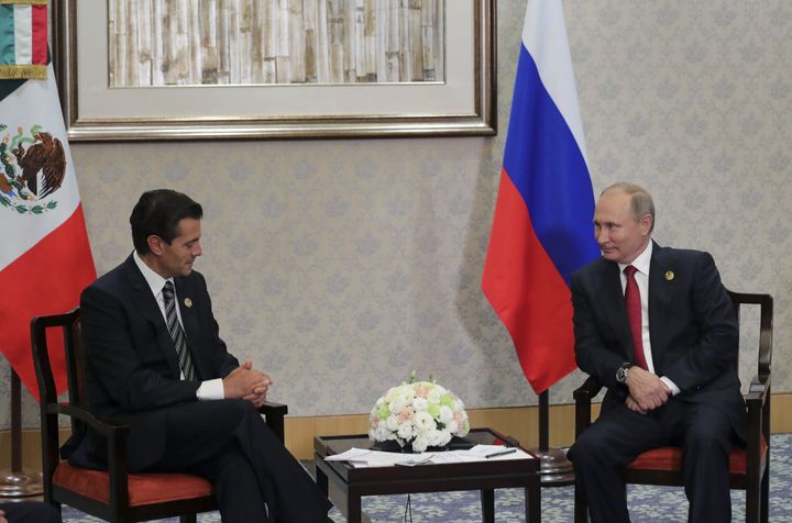 Russia's President Vladimir Putin (R) meets with Mexico's President Enrique Pena Nieto on the sidelines of the BRICS Summit, in Xiamen, China, 5 September