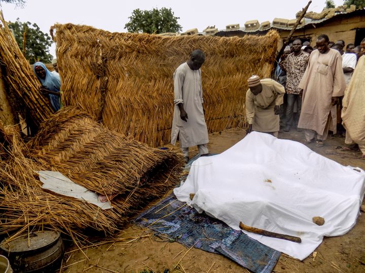 The victims of a Boko Haram suicide bombing in northeast Nigera are covered with a white sheet. File photo from June attack.