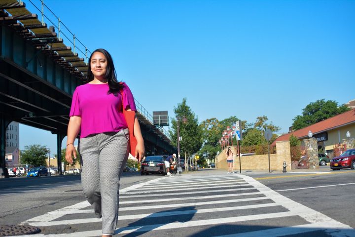 Amanda Farias walking the streets of her neighborhood