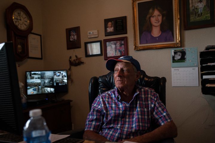 Tim Miller, founder and director of EquuSearch, sits in his office in front of a portrait of his daughter, Laura, who was abducted and murdered in 1984. Miller founded EquuSearch in 2000 in honor of her.