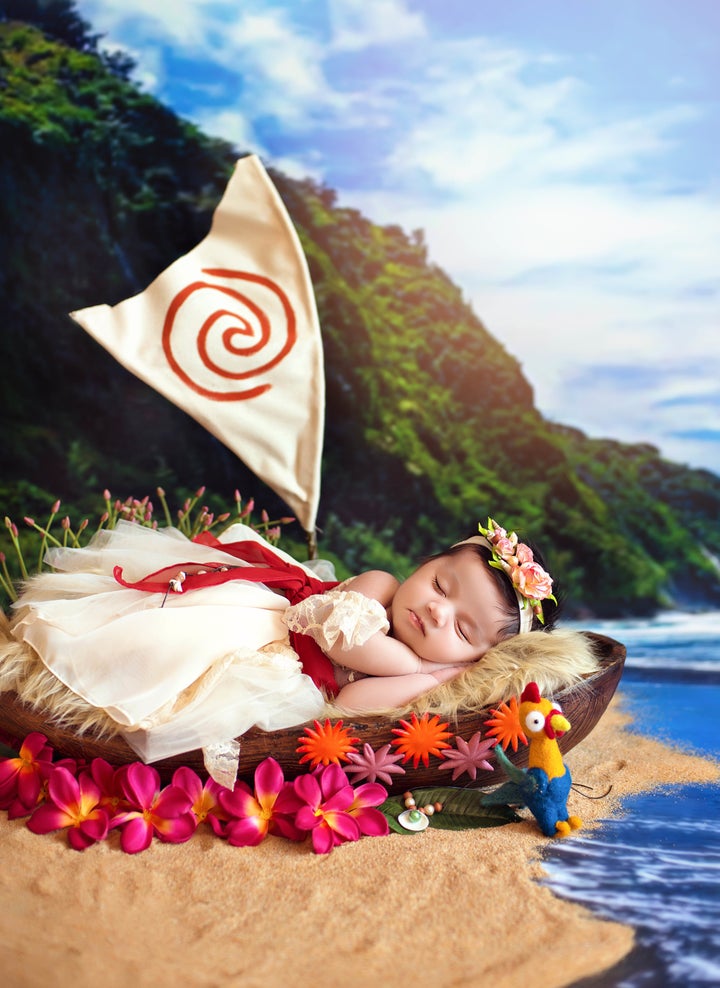 Baby Moana sleepily posed alongside the film's funny rooster character named Heihei.