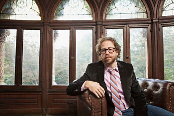 <p>Jonathan Coulton sits! </p>