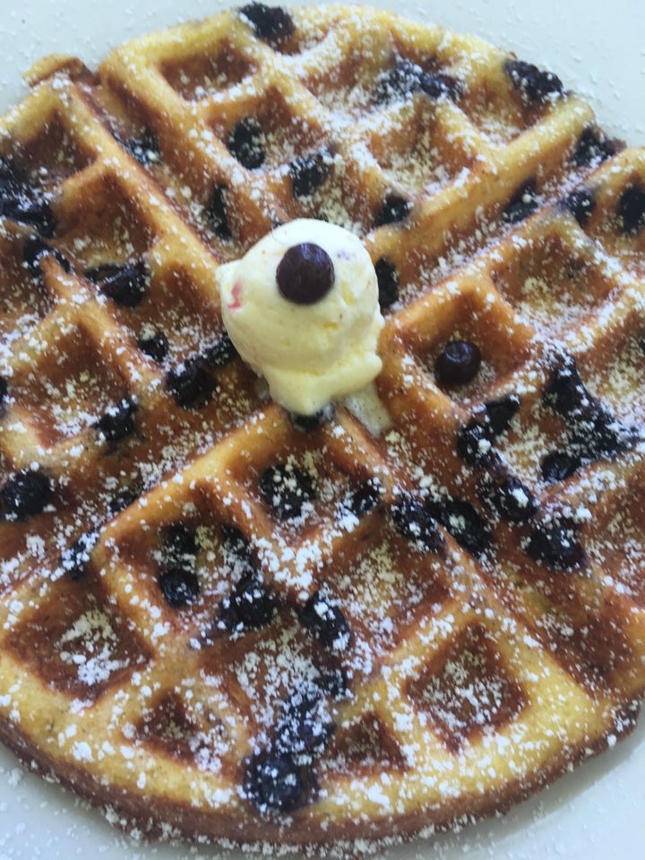 The blueberry cornbread waffles at Cafe 222 are delicious, transporting you to endless summer.