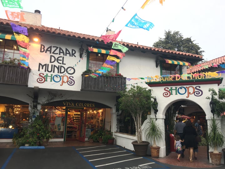 Colorful storefronts transport newcomers to the center of an old Mexican market.