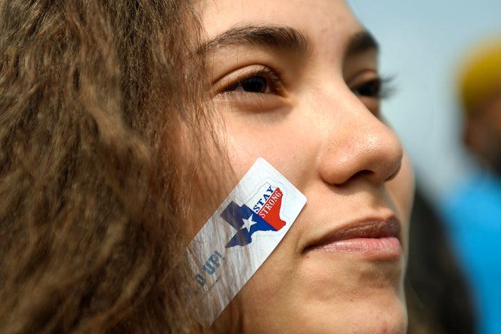 A 10th grader with a 'stay strong' sticker marched with students, immigrants and impacted individuals to Tivoli Quad on Denver's Auraria Campus to defend the Deferred Action for Childhood Arrivals (DACA) program during a city-wide walkout and rally.