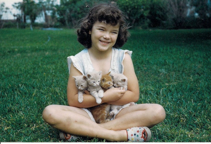 <p>Flicka at 8 years old with her first set of furry friends</p>
