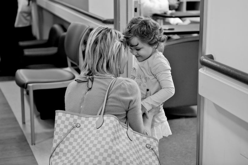 Kate Snee has a private moment with a pediatric cancer patient.