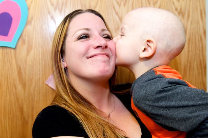 Mom of pediatric cancer patient tears up over kiss from child.