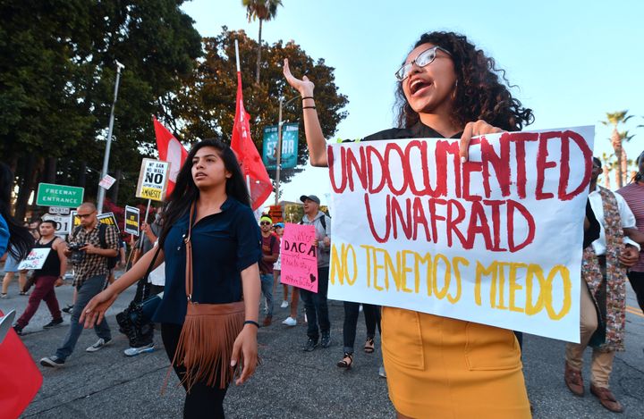 Young immigrants, activists and supporters of the DACA program march through downtown Los Angeles on Tuesday.