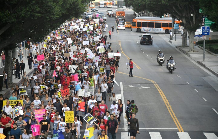 Young immigrants, activists and supporters of the DACA program march through downtown Los Angeles, California on September 5, 2017.