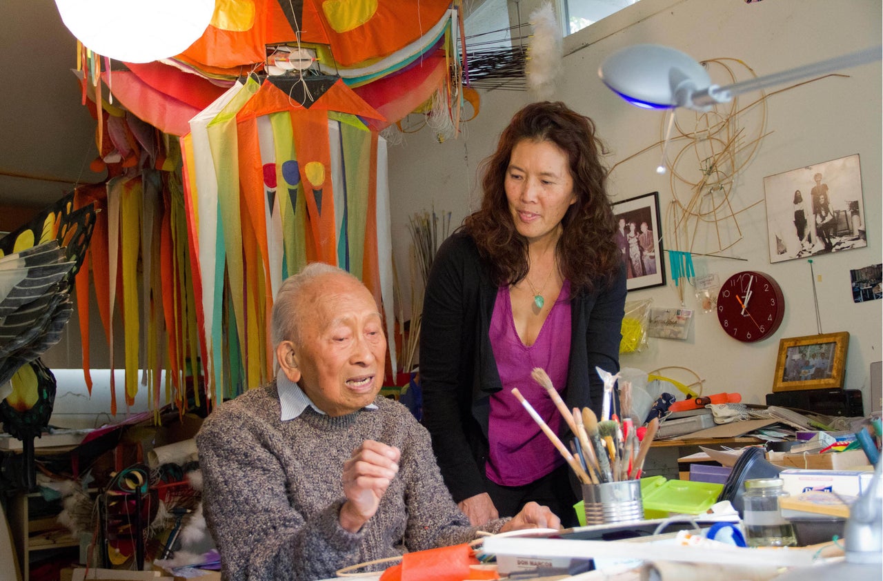 Pamela Tom and Tyrus in Tyrus's kite studio.