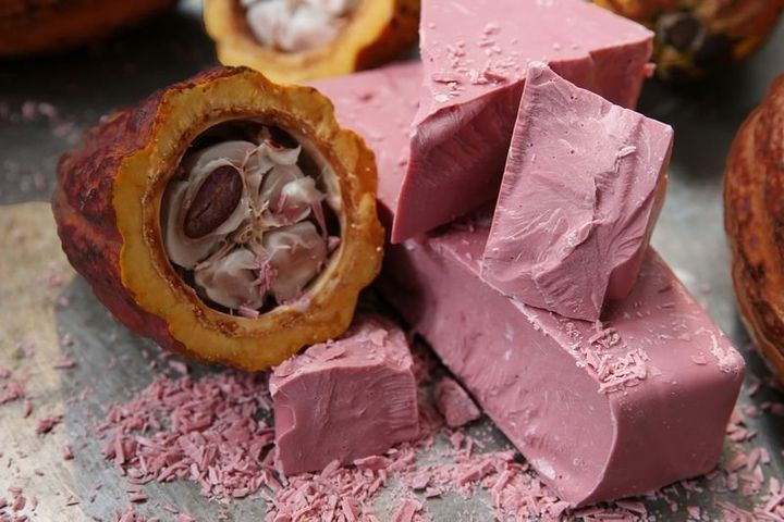 Ruby chocolate made by the producer Barry Callebaut and the cocoa pod that was used to produce this naturally-pink hued confection.