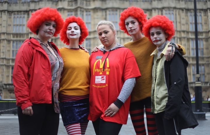 Jess Bower (centre) who is on strike from the McDonald's restaurant in Crayford, SE London, with supporters during a rally at Old Palace Yard, London, after staff voted overwhelmingly in favour of industrial action, amid concerns over working conditions and the use of zero-hour contracts