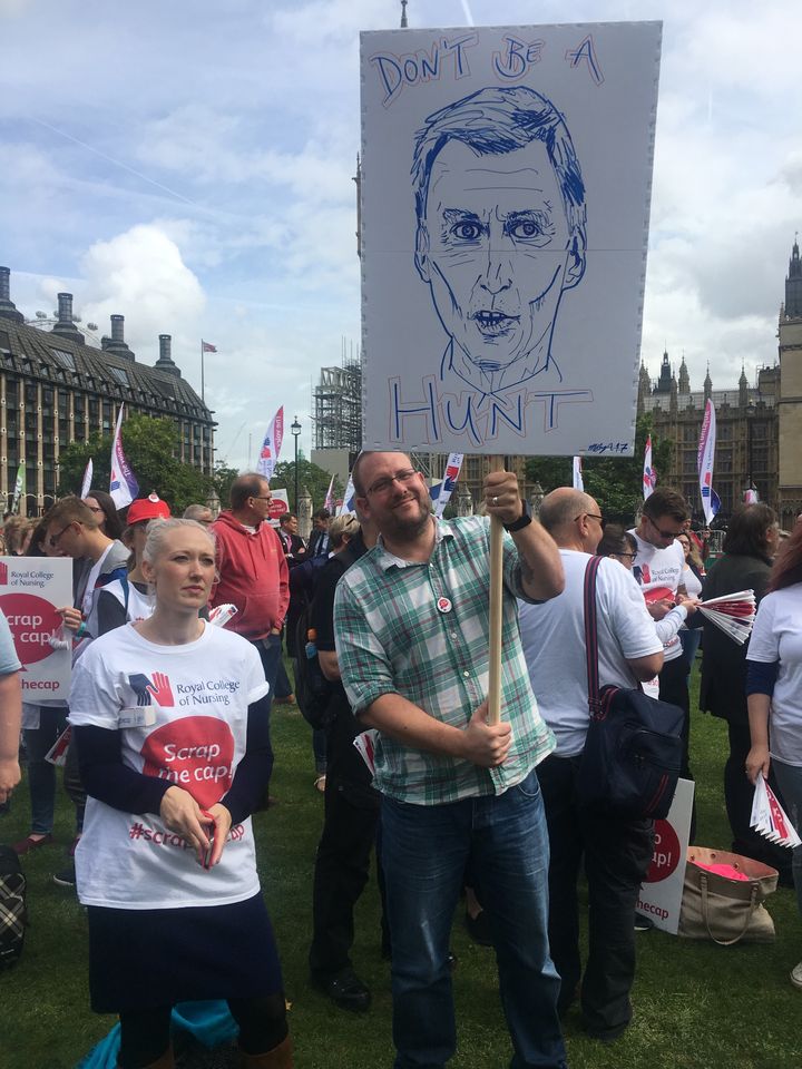 James Watson, pictured, with a Jeremy Hunt placard (artwork: Mark Boy)