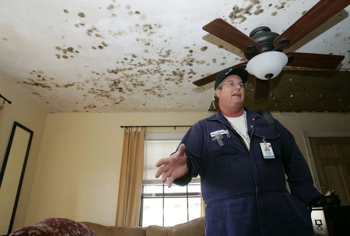 After Hurricane Rita in 2005, a resident of Groves, Texas, appears in his moldy living room. 